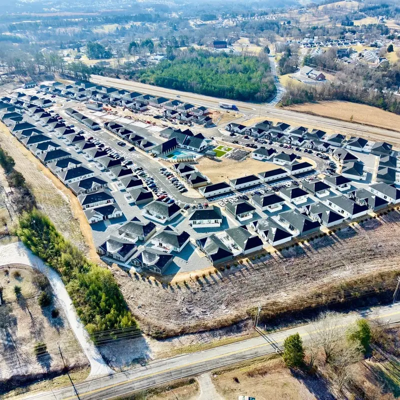 Aerial view of Villas at 321 with graded lots and paved streets along US-321 in Lenoir City